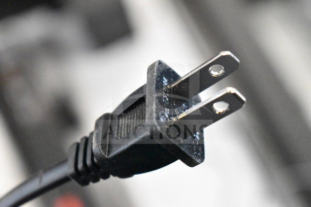 Close-up of a two-prong electrical plug.