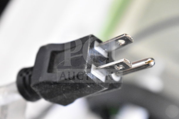 Close-up of a black two-prong electrical plug.