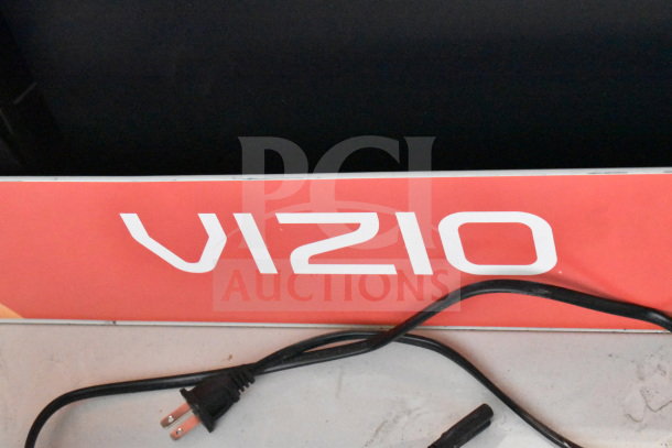 3 store display set with Vizio branding, gaming screen, headphones, LG soundbar. Includes visible power cords.
