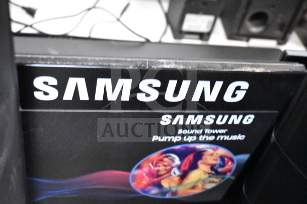 Samsung Sound Tower display, promoting "Pump up the music." Features vibrant graphics, potentially includes a speaker system.