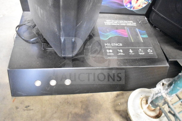 Samsung MX-ST4CB speaker display unit; features include 24-hour battery, IPX5, and party lights. Display base visible.