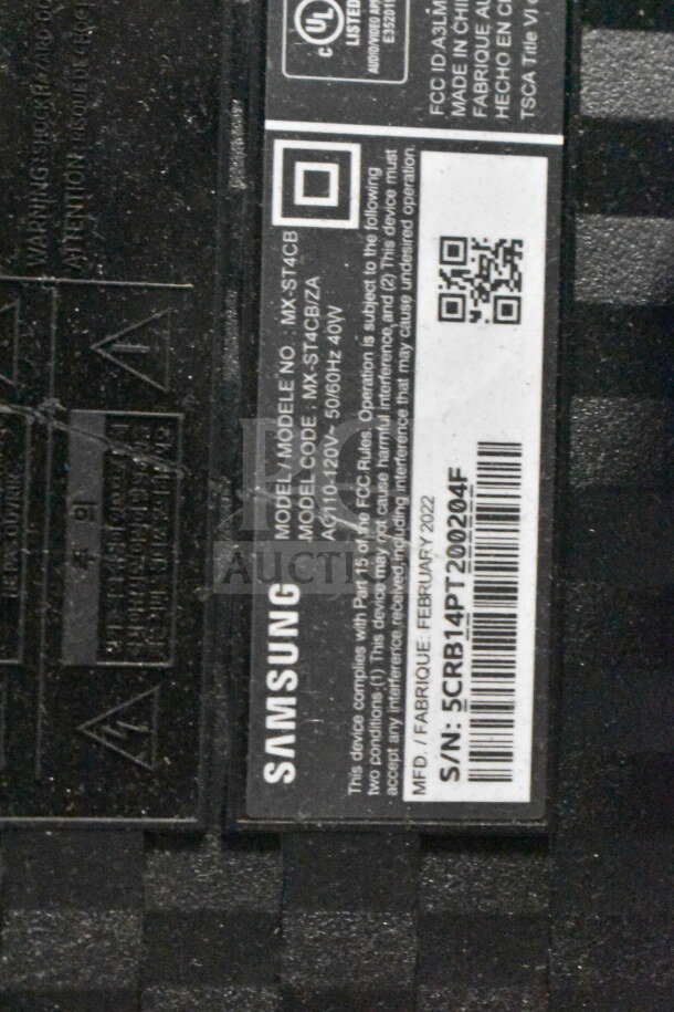 Samsung speaker label showing model MX-ST4CB, compatible with AC 110-120V, 50/60Hz, 40W. Made in China, February 2022.