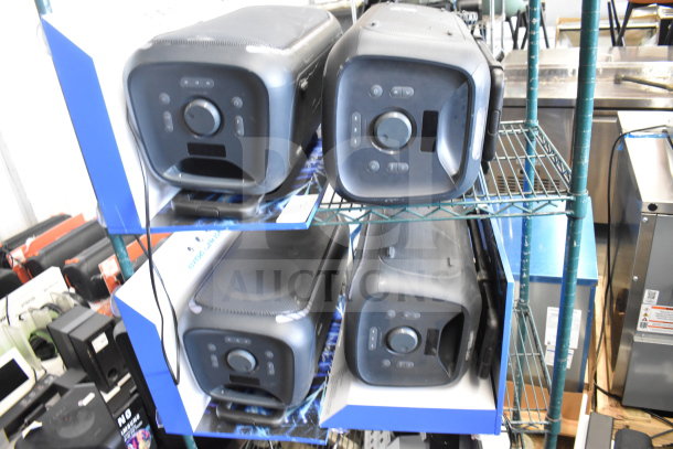 4 Onn large party speakers on store display shelf. Features control knobs, front-facing design, in good condition.