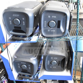 4 Onn large party speakers on store display shelf. Features control knobs, front-facing design, in good condition.