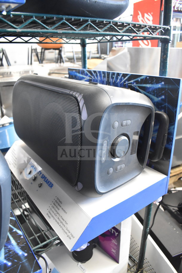 Onn Large Party Speaker on store display, features control panel and handle, sturdy design, excellent condition.