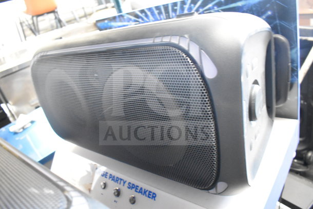 Onn Large Party Speaker on display, black with front mesh grille, control knobs on the side, in excellent condition.