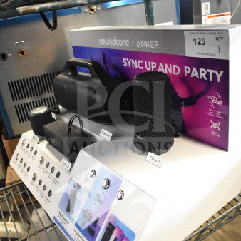 Store display featuring Soundcore Anker speakers, including Select Pro and Flare 2 models. Display promotes PartyCast technology.