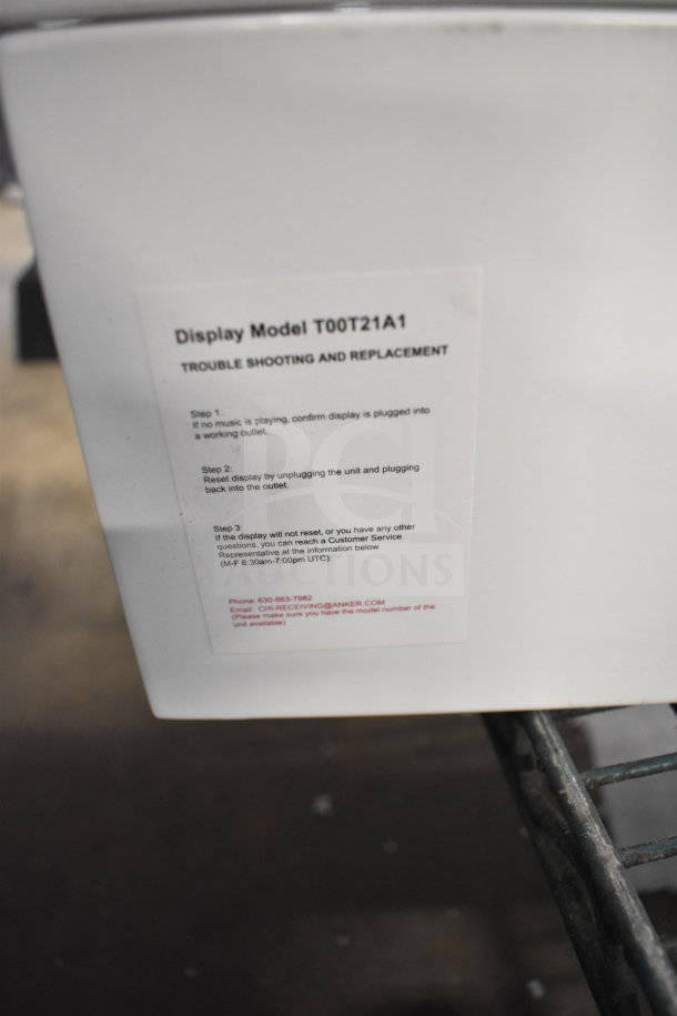 Store display with troubleshooting label for Display Model T00T21A1, includes Anker Soundcore speaker guidelines.