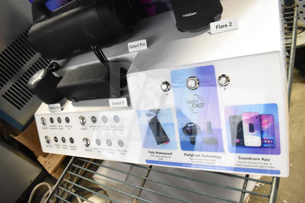 Store display featuring Soundcore Anker speakers, including models Mini 3 Pro, Select Pro, Select 2, Flare 2. Features like waterproof build and PartyCast technology highlighted.