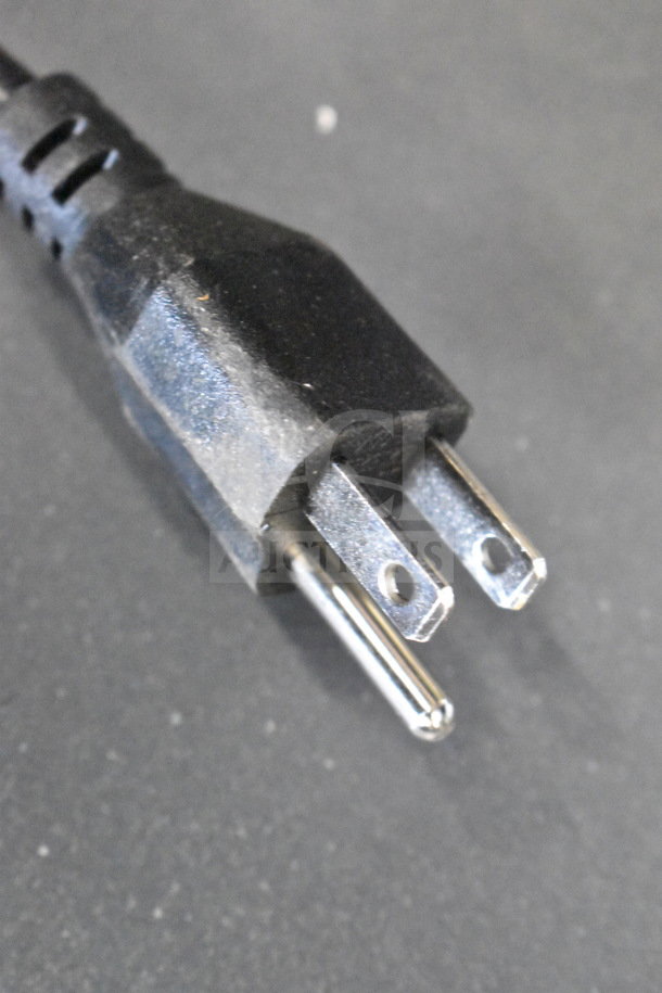 Power plug of an Onn soundbar or speaker, part of a store display. Three-prong design, intact and in good condition.