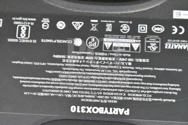 JBL Partybox 310 speaker label with model information, technical specifications, and regulatory markings visible.