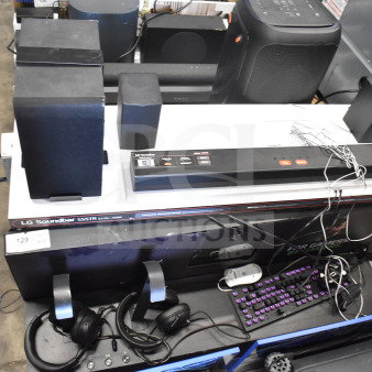 LG Soundbar S55TR with speakers, headphones, and display. Includes visible cables. Condition appears used. Auction item 129.