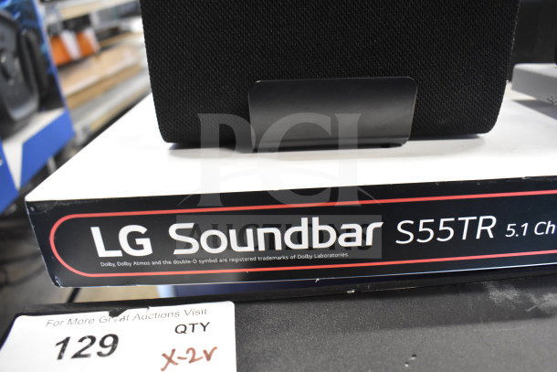 LG Soundbar S55TR 5.1 Channel on store display, featuring Dolby Atmos. Includes headphones and speaker.