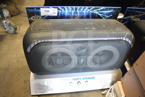 Onn large party speaker on store display, featuring Bluetooth, 640W peak power, rechargeable battery, and LED effects. Light wear.
