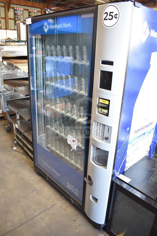 Crane 5800-4HC vending machine, accepts bills, 115V, 1 phase, for bottled drinks. Visible 25¢ price tag, Member's Mark branding.