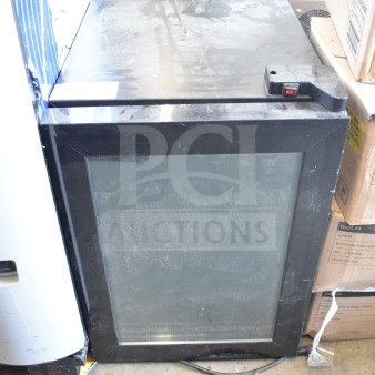 LSD-60 Mini Cooler Merchandiser, glass front, black frame, 115 volts, 1 phase, visible wear, dust on surface, power cord attached.