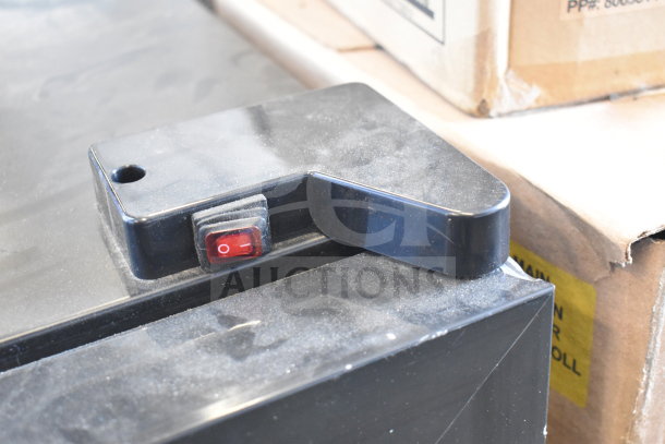 LSD-60 Mini Cooler Merchandiser switch detail, black casing, visible red power button. Condition: dusty, appears functional.