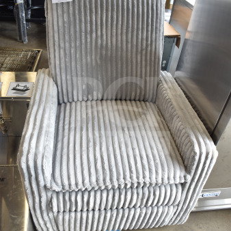 Gray arm chair with vertical pleated upholstery, modern design. Auction label indicates quantity: 1. Appears in good condition.