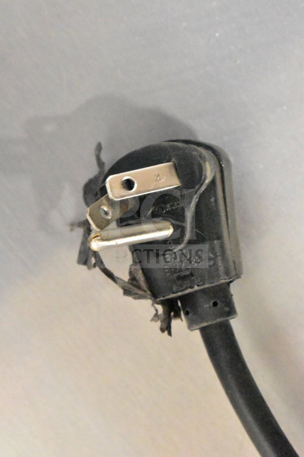 A damaged power plug from Scotsman HID207ABX-1A ice machine, showing frayed wires and exposed prongs.