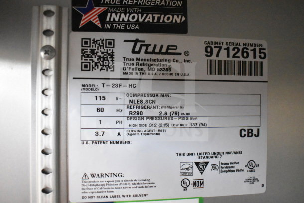 Label on 2019 True T-23F-HC freezer showing model, voltage, refrigerant type, and certifications.