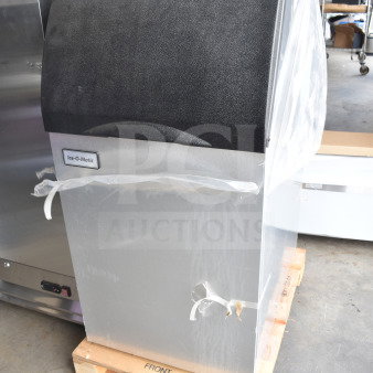 Brand new Ice-O-Matic B42 ice storage bin with minor scratches and dents, 351 lb. capacity, in plastic wrap, on a pallet.