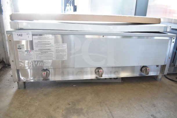 Brand new ServIt 423GST3WELP steam table with three pans, open well, liquid propane; includes undershelf, 10,500 BTU, labels intact.