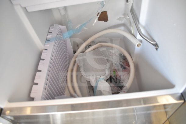 BRAND NEW KoolMore KM-BIM57-PR ice maker interior, showing components, tubing, and packaging. Scratch and dent condition.
