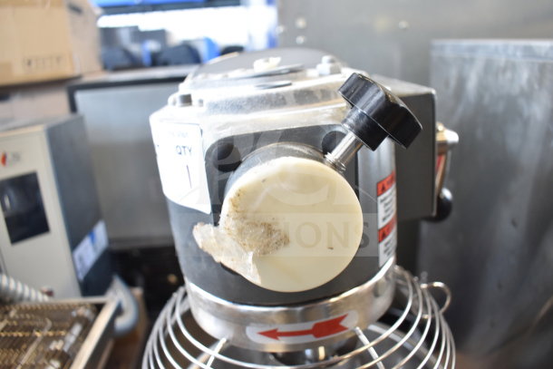 Brand new Avantco 177MX10H countertop 10-quart planetary dough mixer with scratch and dent marks. Includes mixing bowl, bowl guard, paddle, whisk, and dough hook attachments. 120 volts, 1 phase.