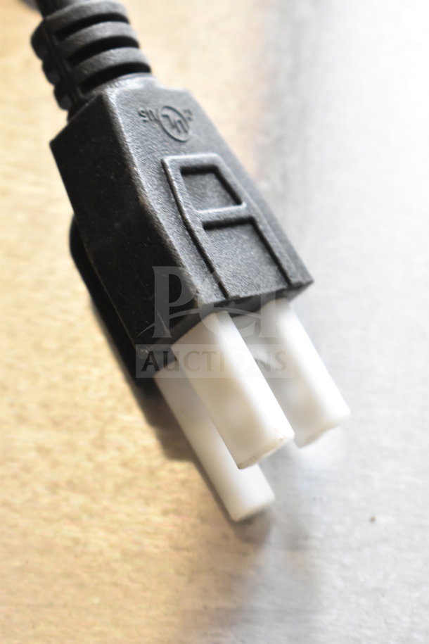 Close-up of a power plug connector, detail of a new Avantco 177MX10H mixer appliance, 120 volts, single phase.