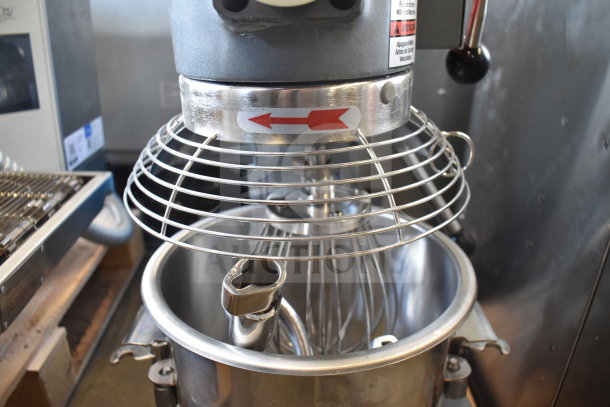 Brand new Avantco 177MX10H 10-quart planetary dough mixer with bowl, guard, paddle, whisk, and hook attachments. 120V.
