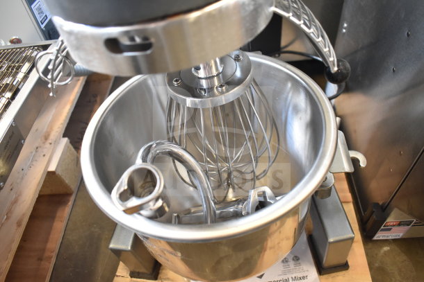 Avantco 177MX10H 10 Quart Planetary Dough Mixer with bowl, guard, paddle, whisk, and dough hook. New, minor dents.