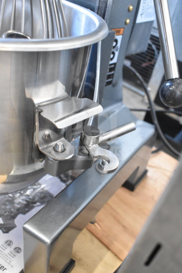 Brand new Avantco 177MX10H 10 Qt planetary dough mixer, stainless steel bowl, and attachments; some cosmetic dents.