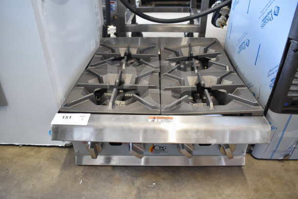 BRAND NEW scratch and dent Cooking Performance Group 351RCPG24NL gas range, 4 burners, 88,000 BTU, visible control knobs.