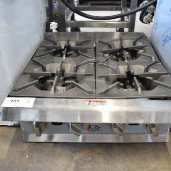 BRAND NEW scratch and dent Cooking Performance Group 351RCPG24NL gas range, 4 burners, 88,000 BTU, visible control knobs.