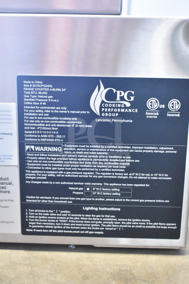 Alt text: "Cooking Performance Group 351RCPG24NL gas range label detailing model, BTU, and use instructions. Brand new condition."