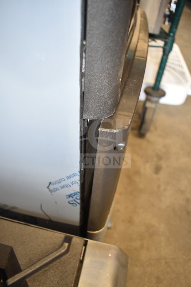 New Manitowoc UDP0065A-161 undercounter ice machine with visible scratches. Includes 31 lb. bin, 62 lb. capacity, 115V.