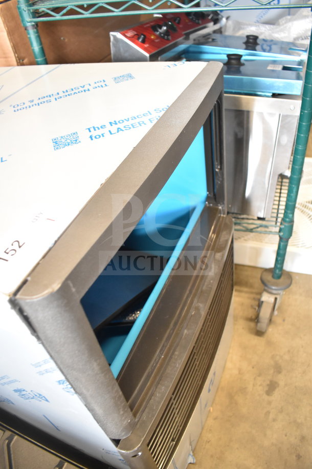 Brand new Manitowoc UDP0065A-161 undercounter ice machine with minor scratches, 31 lb. bin, 62 lb. capacity, 115V.