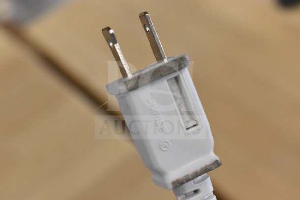 "Close-up of a power plug for the Hurricane HGC736501 Box Fan, 115 volts, 1 phase, showing visible markings."