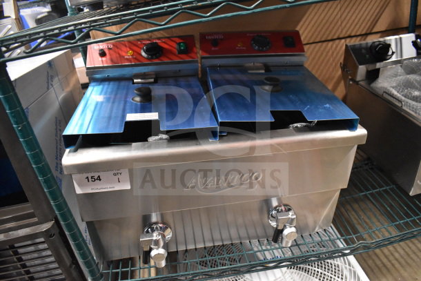Avantco 177F202 dual tank fryer, brand new, 30 lb. capacity, electric, two fry baskets and lids, minor cosmetic dents.