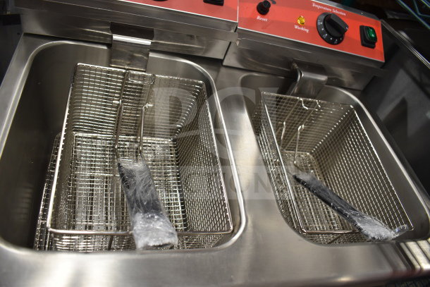 Brand new Avantco 177F202 dual tank electric fryer, 30 lb. capacity, 2 baskets with lids, medium-duty, 208-240V, scratch and dent.