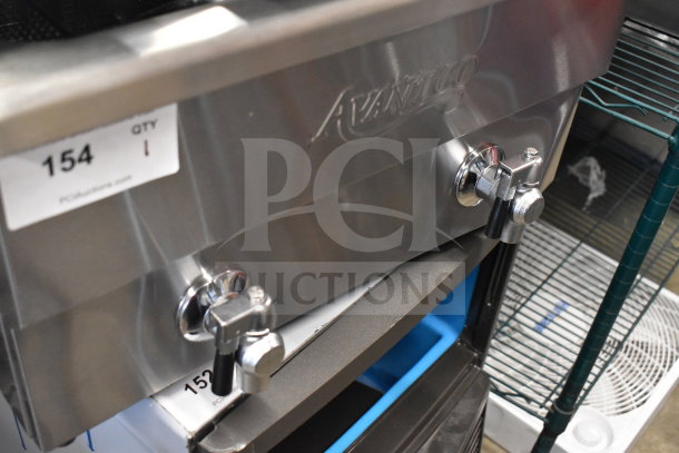Brand new Avantco 177F202 30 lb. dual tank electric fryer, stainless steel, two baskets, 208-240V, auction label visible.