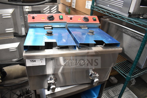 Brand new Avantco 177F202 dual tank electric fryer, 30 lb capacity, with 2 fry baskets and lids, 208-240V, 1 phase.