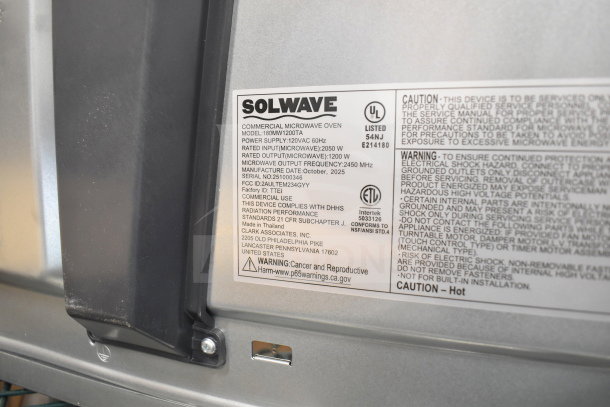 BRAND NEW Solwave 180MW1200TA Commercial Microwave, 1.2 cu. ft., push button controls, 120V, label detailing specs and warnings.
