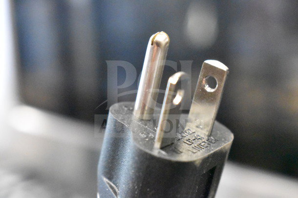 Close-up of a three-prong power plug for a 2025 Solwave 180MW1200TA commercial microwave, 120 volts, 1 phase.