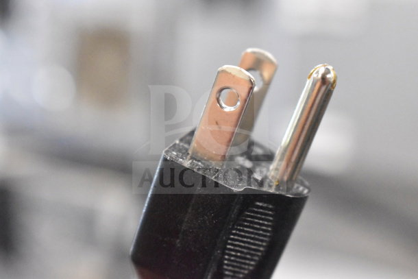 Close-up of a black 120V power plug for a RiceMaster commercial rice warmer, showcasing prongs and durable finish.