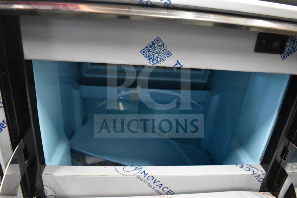 Brand new Avantco 194EUCF130A ice machine, 44 lb. bin, 134 lb. capacity, 115 volts, minor scratches, QR code on surface.