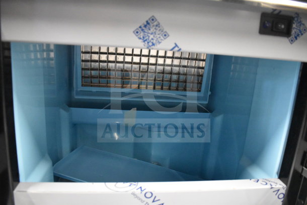 Brand new Avantco 194EUCF130A undercounter ice machine; 44 lb. bin, 134 lb. capacity, 115V, 1-phase, visible scratch and dent.