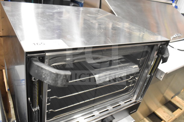 Alt text: Vollrath COV-120-HS half-size countertop convection oven, new condition, visible chipped glass, 120V, 1 phase.