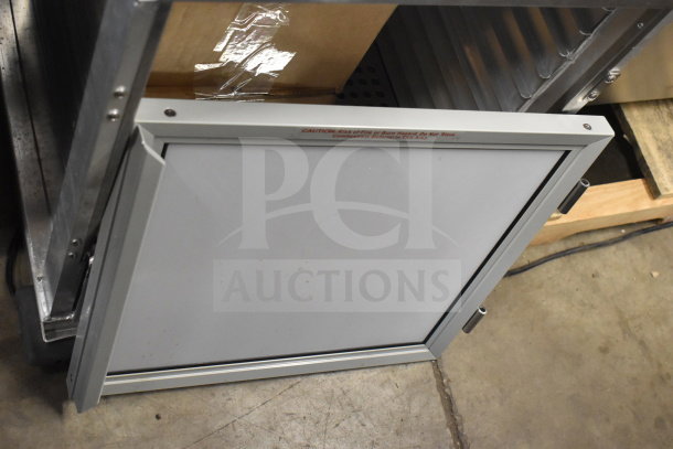 Brand new 2025 Mainstreet 541HPU1812 undercounter cabinet, clear door detached, visible caution label, 120V, 1 phase.