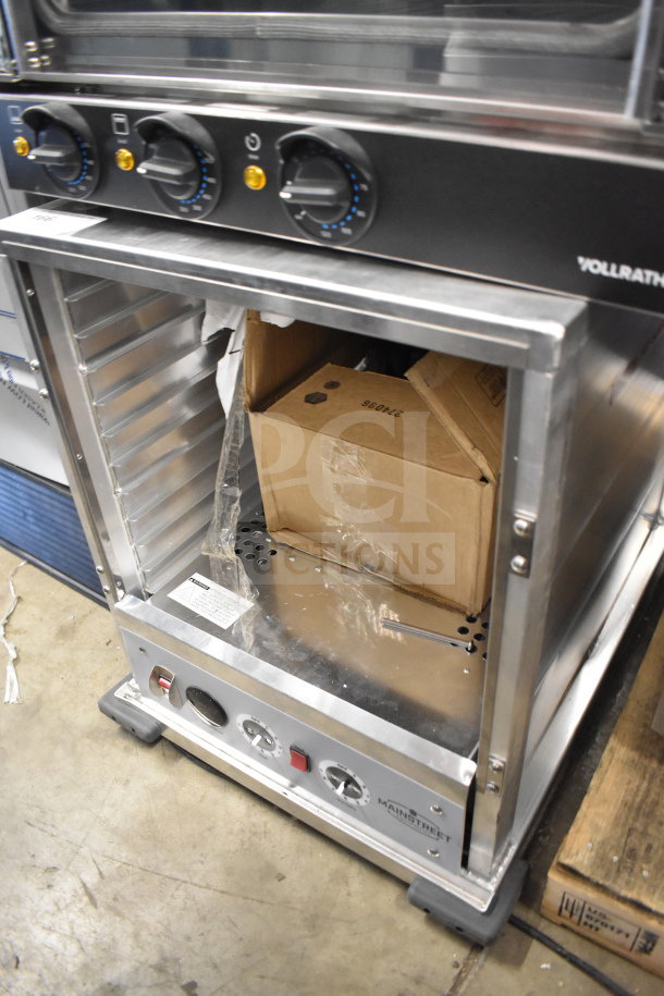 Mainstreet 541HPU1812 undercounter half-size heated cabinet, clear door needs reattachment, 120V, 1 phase, brand new condition.